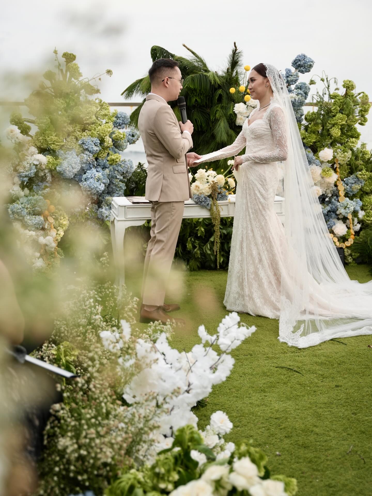 Wedding ceremony with blue and green floral decoration